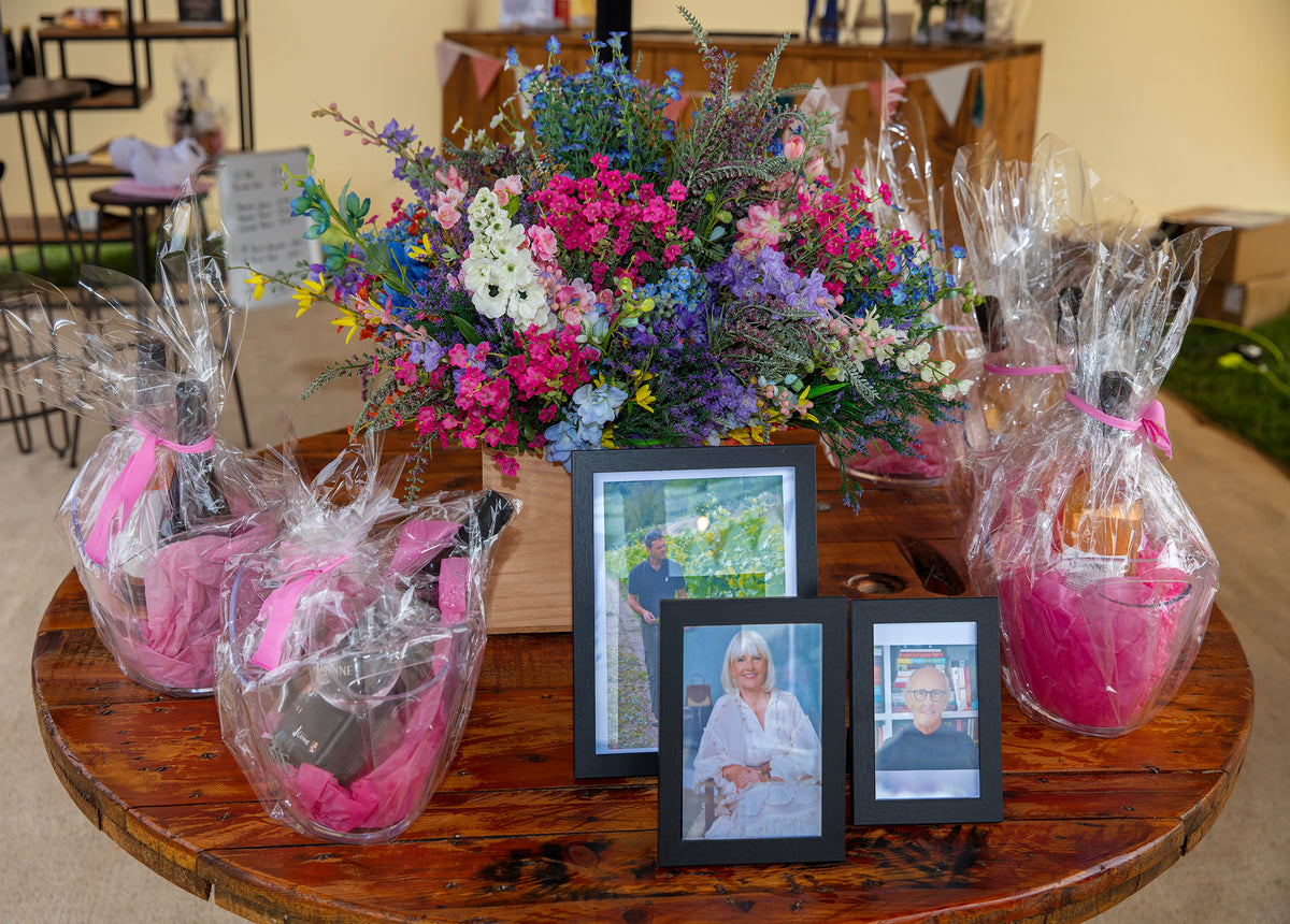 Close-up of Domaine des Jeanne gift hampers at CarFest 2025