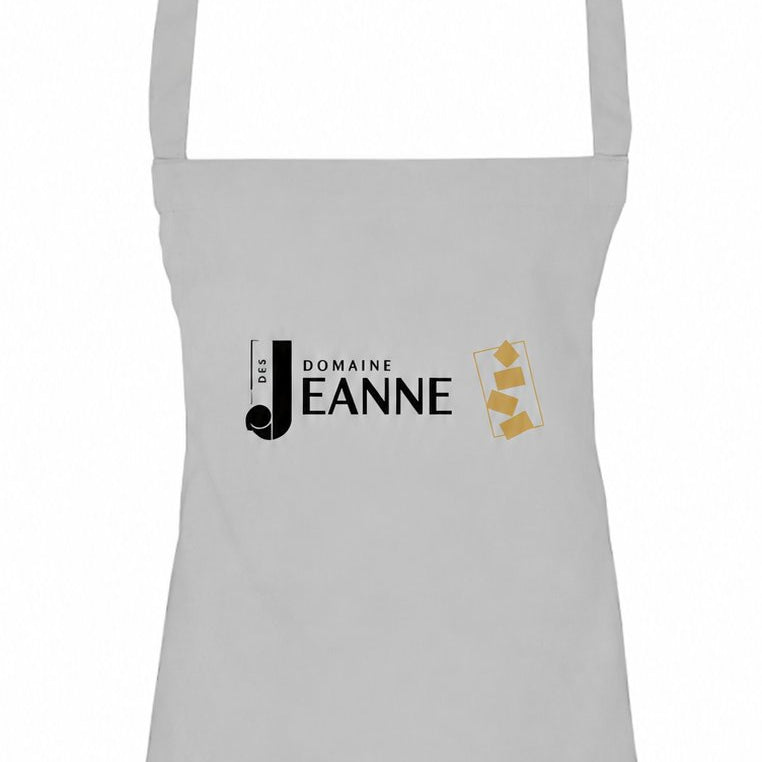 Grey apron with Domaine des Jeanne logo, close-up of the bib