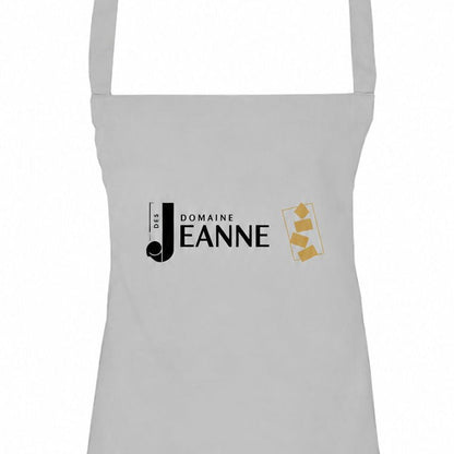 Grey apron with Domaine des Jeanne logo, close-up of the bib