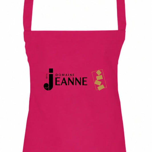 Pink apron with Domaine des Jeanne logo, close-up of the bib